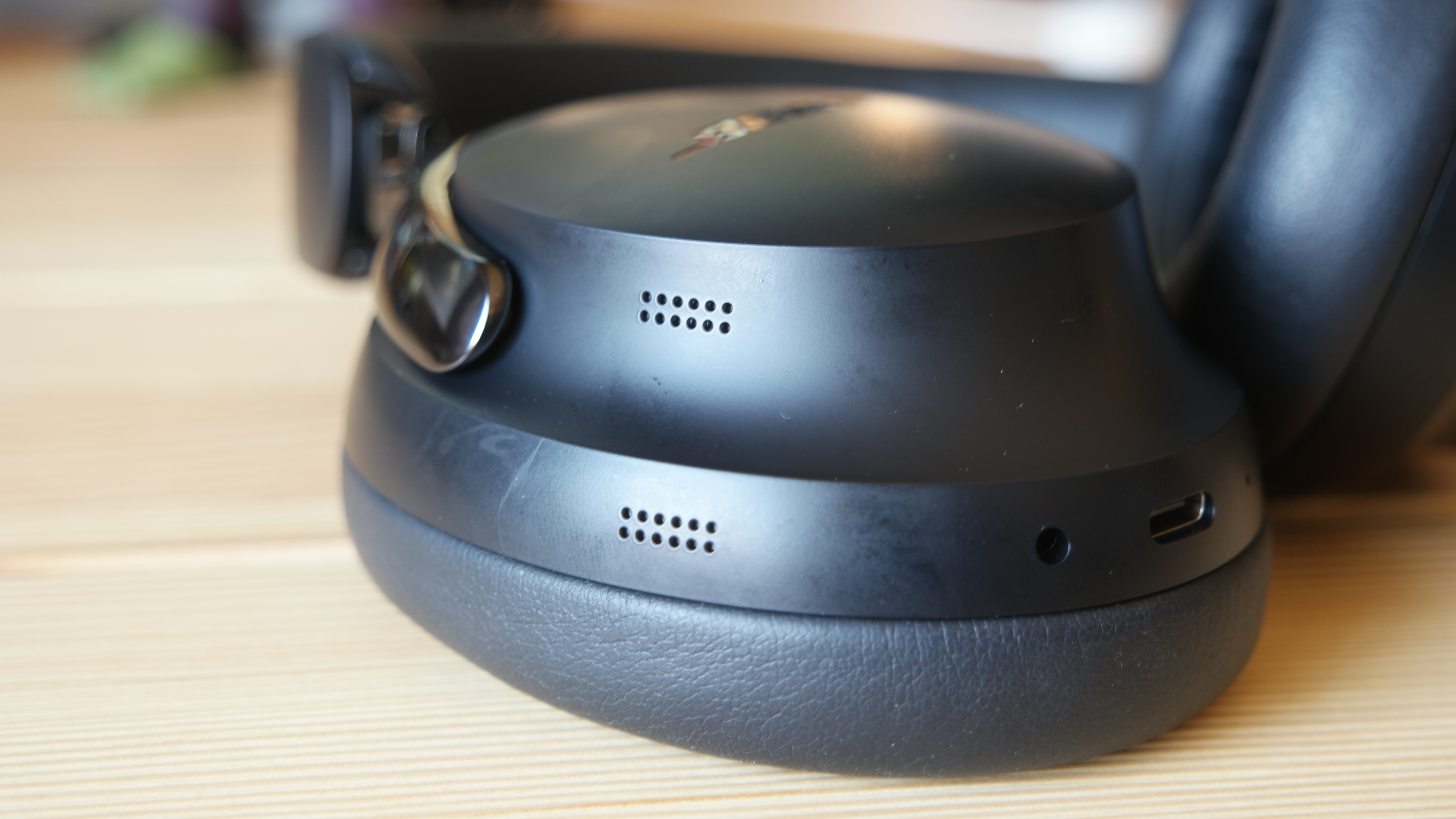 Bose QuietComfort Ultra Headphones (2nd Gen) closeup of the microphones on the ear cup