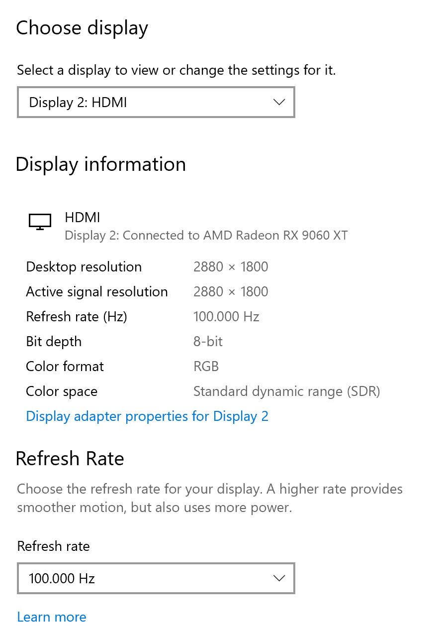 Ένα παράθυρο ρυθμίσεων εμφανίζει την Οθόνη 2 συνδεδεμένη μέσω HDMI σε AMD Radeon RX 9060 XT με ανάλυση επιφάνειας εργασίας 2880 x 1800 και ρυθμό ανανέωσης 100.000 Hz.