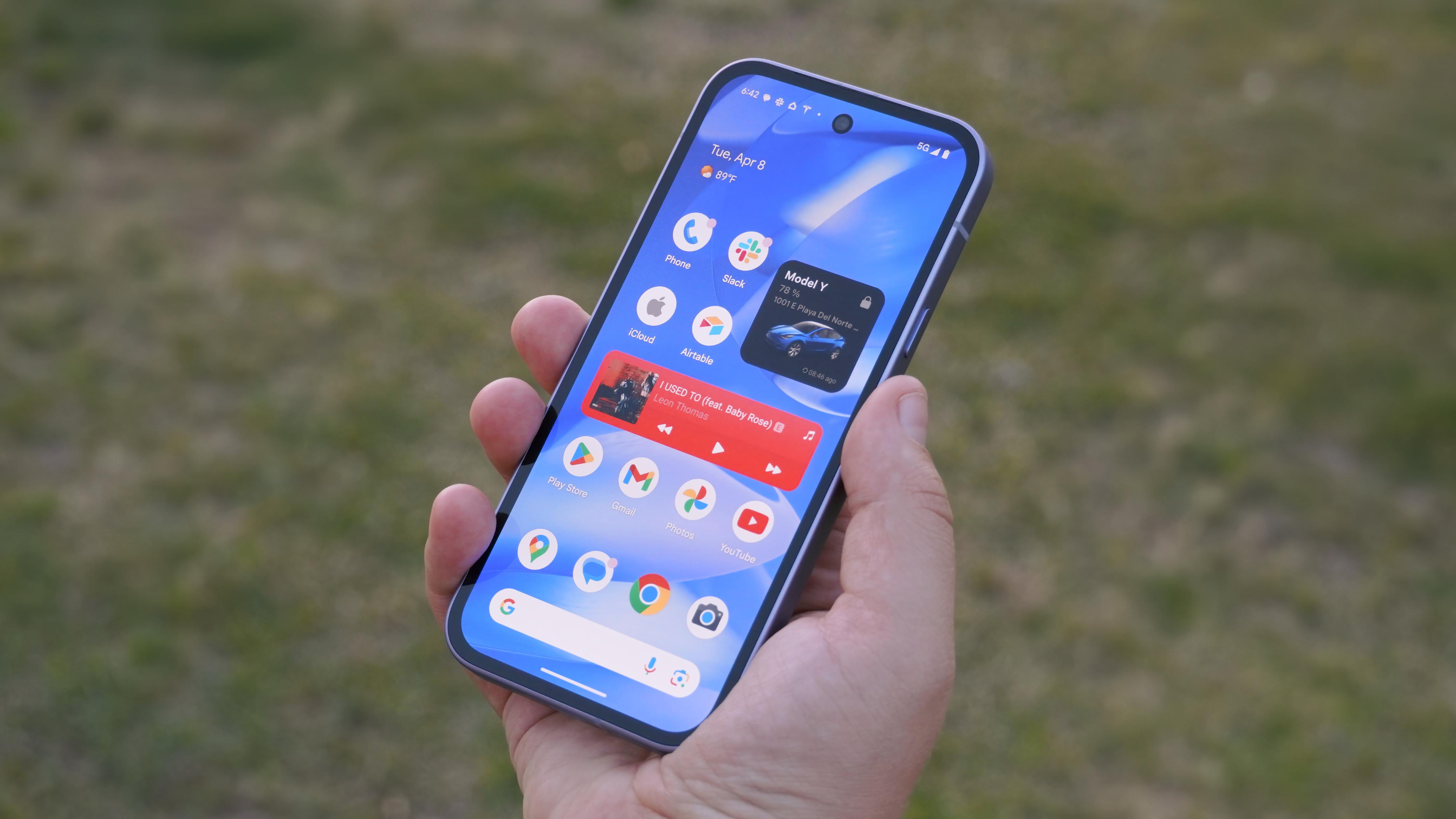 OnePlus 15R vs. Google Pixel 9a: Battle of the value phones The Google Pixel 9a in Iris in the hand.