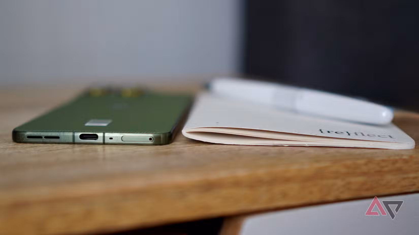 The Motorola Edge 70 with a notebook