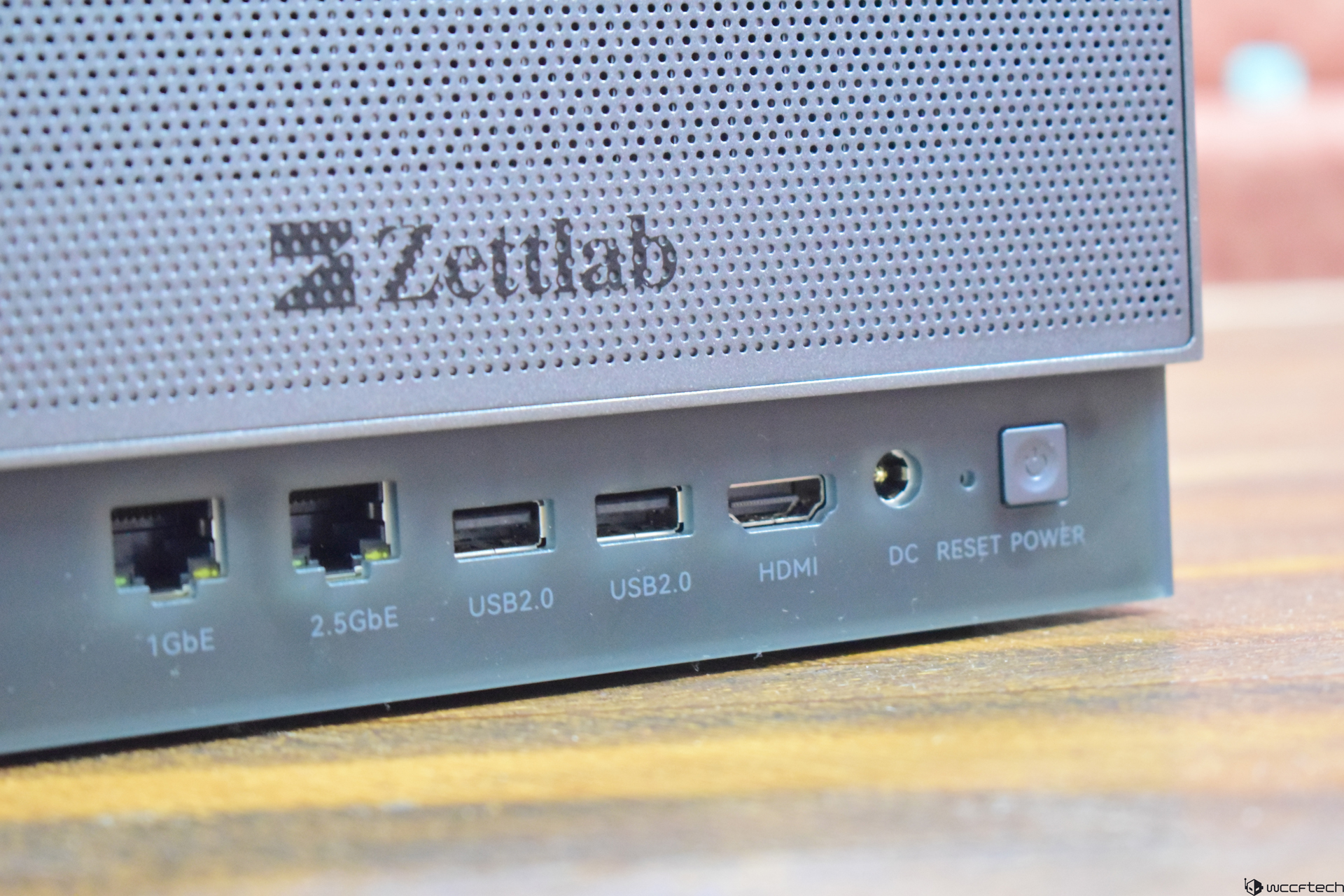 Zettlab D4 Review — A Convenient Budget AI NAS For Photographers And Content Creators The image shows the back panel of a Zettlab device featuring ports labeled '1GbE,' '2.5GbE,' 'USB2.0,' 'HDMI,' and 'DC RESET POWER.'
