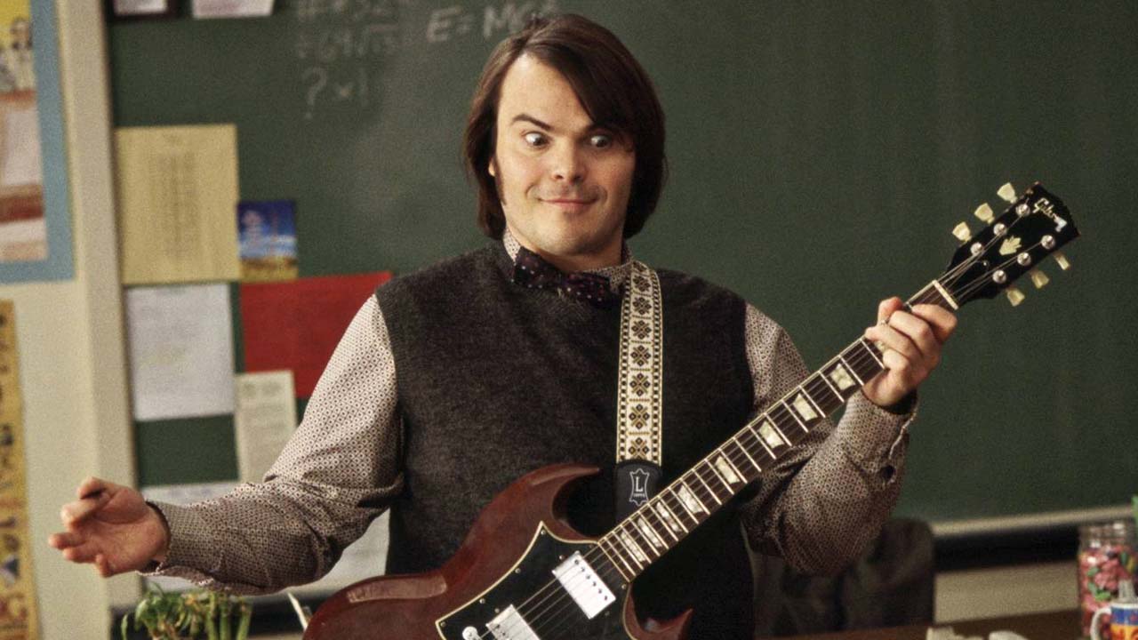 Jack Black holds a guitar