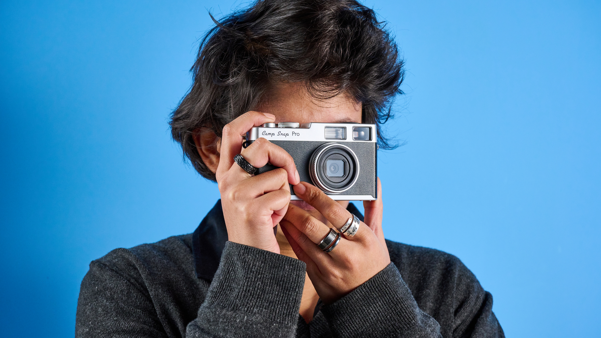 Camp Snap CS-Pro in black and silver photographed on a blue background